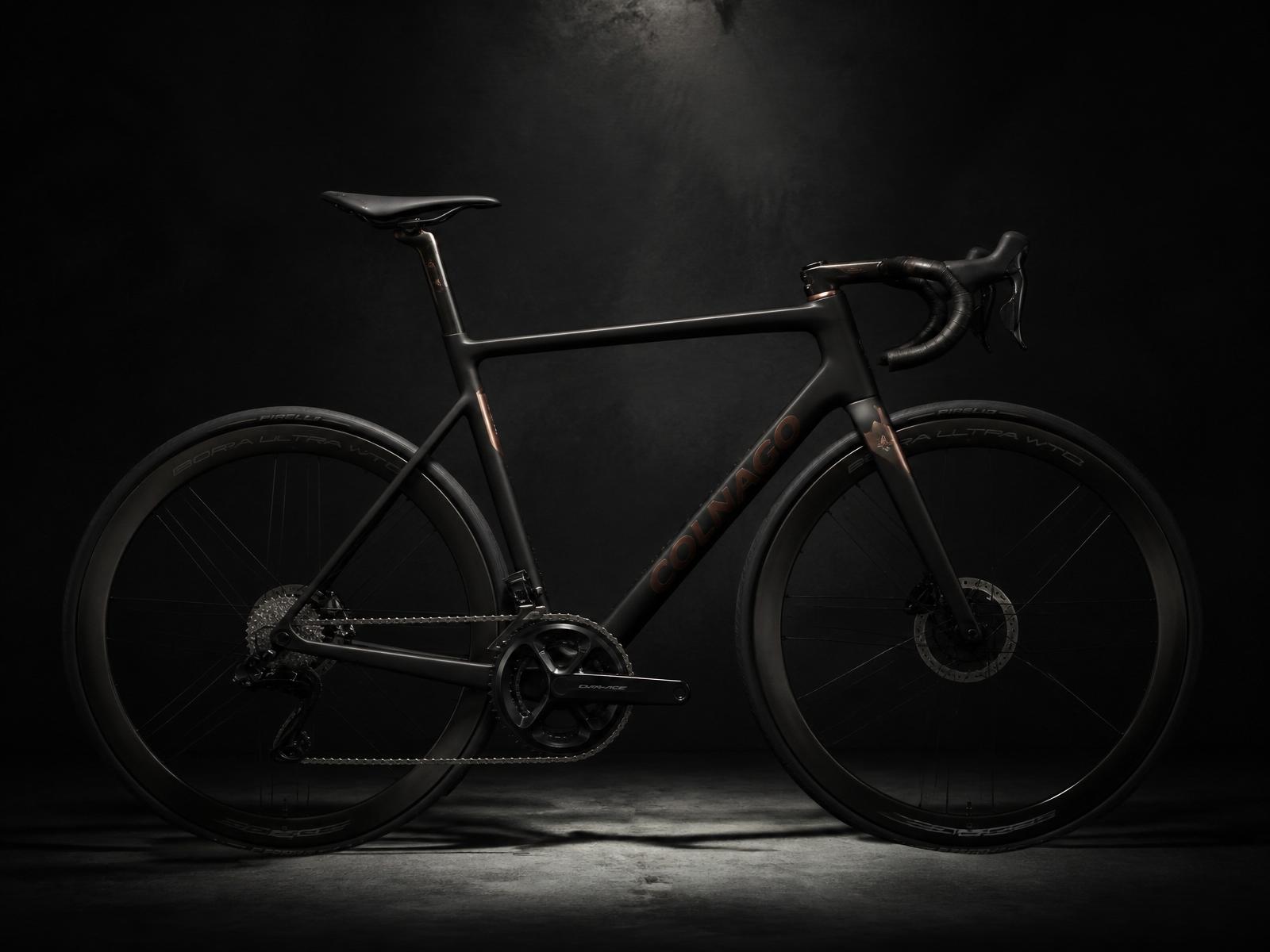 Matte black premium road bicycle in a spotlight